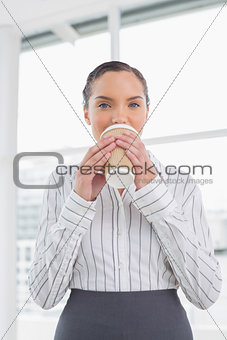 Peaceful businesswoman drinking coffee