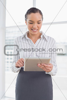 Stylish businesswoman using a tablet pc