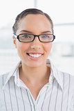 Smart smiling businesswoman with glasses