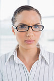 Angry businesswoman with reading glasses