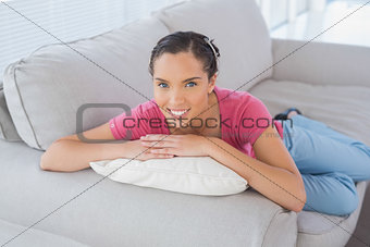 Peaceful woman lying on the sofa