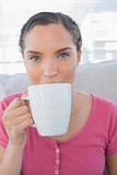 Portrait of happy woman drinking a coffee