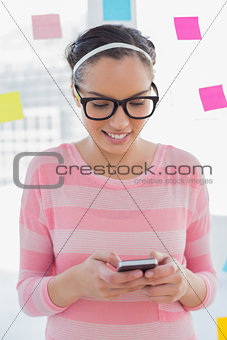 Smiling artist texting