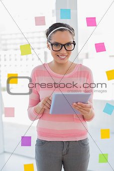 Happy artist using tablet and looking at camera