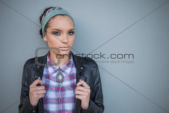 Beautiful woman with hairband posing and looking at camera
