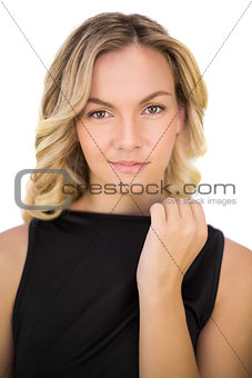 Peaceful gorgeous blonde in black dress posing