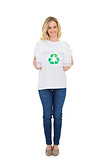 Smiling blonde volunteer holding recycling box