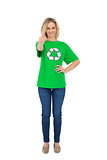 Happy blonde environmental activist giving thumb up to camera