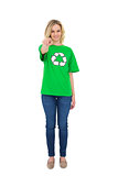 Happy blonde environmental activist pointing at camera