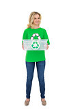 Smiling pretty environmental activist holding recycling box