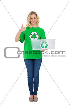 Smiling cute environmental activist holding recycling box thumb up