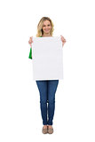 Smiling cute blonde holding white sign