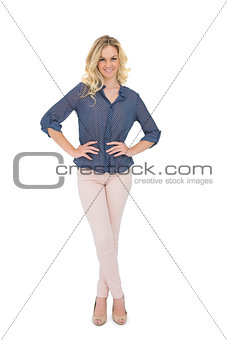 Smiling gorgeous blonde wearing classy clothes posing