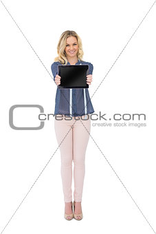 Happy pretty fashion designer showing tablet