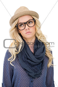 Serious trendy blonde with classy glasses posing