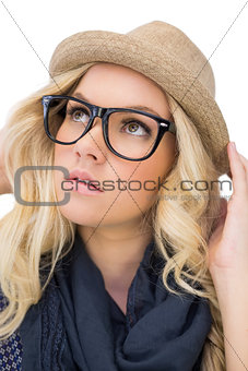 Thoughtful trendy blonde with classy glasses posing