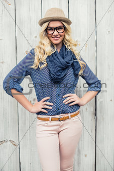 Smiling fashionable blonde posing outdoors