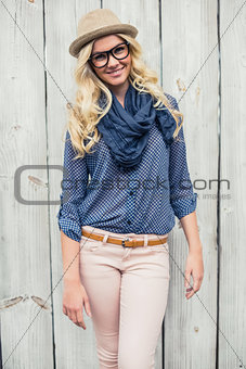 Cheerful fashionable blonde posing outdoors