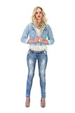 Serious casual blonde wearing denim clothes posing