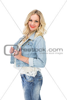 Cheerful casual blonde wearing denim clothes posing