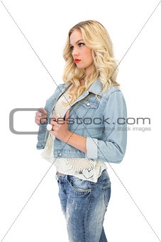Thinking casual blonde wearing denim clothes posing