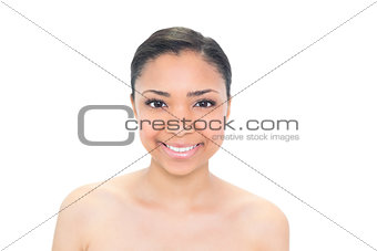 Smiling young dark haired model looking at camera