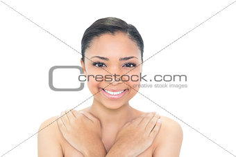 Cheerful young dark haired model looking at camera