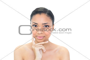 Content young dark haired model looking at camera