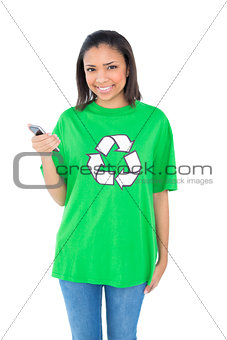 Content dark haired environmental activist holding a mobile phone