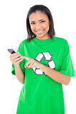 Joyful dark haired environmental activist using a mobile phone