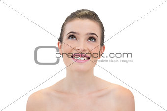 Delighted natural brown haired model looking up