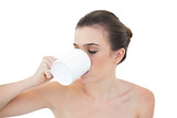 Calm natural brown haired model drinking coffee