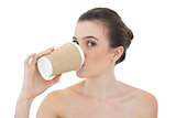 Attractive natural brown haired model drinking coffee