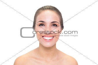 Smiling young brunette woman looking up
