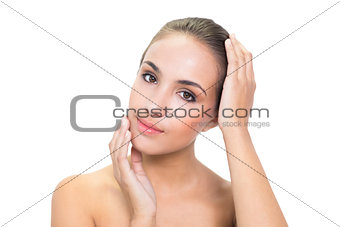 Content young woman holding her head