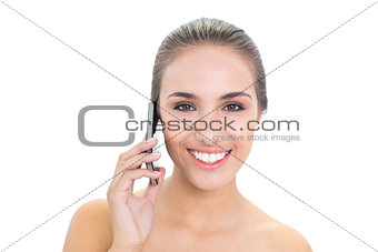 Lovely smiling brunette woman using a mobile phone