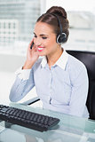 Happy businesswoman using headset