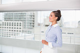 Laughing brunette businesswoman standing