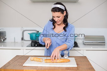 Happy gorgeous model cutting baguette