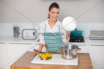 Smiling pretty woman cooking