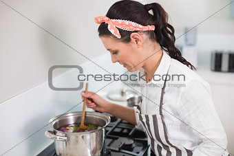 Cheerful gorgeous cook posing