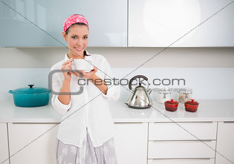 Content gorgeous woman holding tea