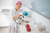 Content gorgeous woman preparing tea