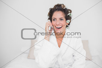 Laughing natural brunette phoning