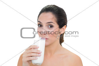 Content bare brunette drinking glass of milk