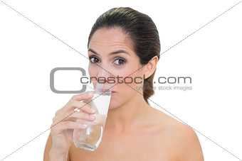 Content bare brunette drinking glass of water