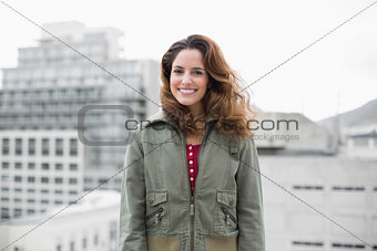 Content gorgeous brunette in winter fashion looking at camera