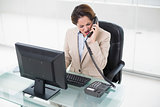 Angry businesswoman shouting into phone