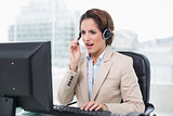 Angry businesswoman shouting in headset