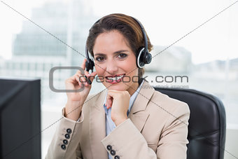 Content businesswoman touching headset